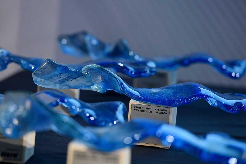 blue glass wave trophies from cruise ship interiors awards 2021