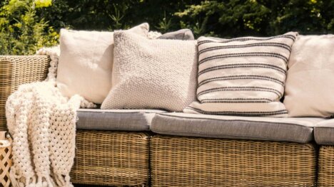 Girones outdoor fabrics featured on a wicker sofa and footstool