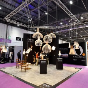 secto design's booth at csi europe 2022 featuring wooden lighting