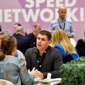 csi vips sat at tables talking to suppliers at the speed networking session