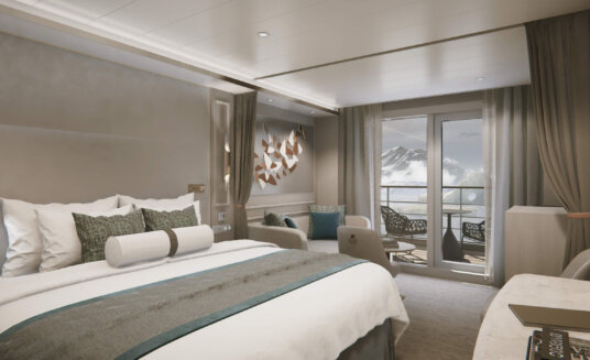 a bedoom on board silver endeavour featuring a king sized bed and a balcony